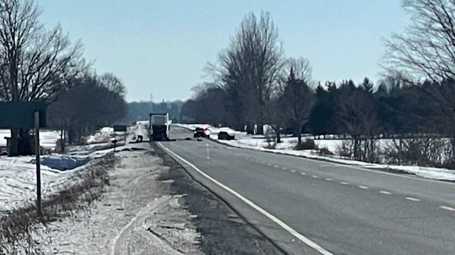 OPP are on scene of a crash involving a transport truck and a compact car on Highway 19, north of Tillsonburg, Ont., on Feb. 2, 2023. (Gerry Dewan/CTV News London)
