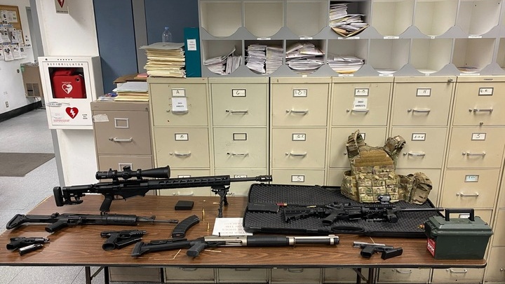This photo provided by the Los Angeles Police Department shows guns and ammunition that were found in an L.A. apartment. A man who reportedly made violent threats was arrested and investigators found a cache of guns and ammunition in his Hollywood high-rise apartment, where several rifles were pointed at a nearby park, police said Wednesday, Feb. 1, 2023. (Los Angeles Police Department)