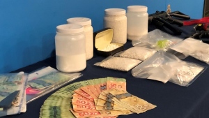 Police seized approximately $9,000 in cash, as well as fentanyl, cocaine and thousands of unmarked pills that investigators are working to identify. (RCMP)