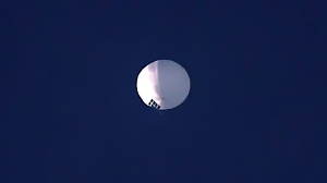 A high altitude balloon floats over Billings, Mont., on Wednesday, Feb. 1, 2023. The U.S. is tracking a suspected Chinese surveillance balloon that has been spotted over U.S. airspace for a couple days, but the Pentagon decided not to shoot it down due to risks of harm for people on the ground, officials said Thursday. (Larry Mayer/The Billings Gazette via AP) 