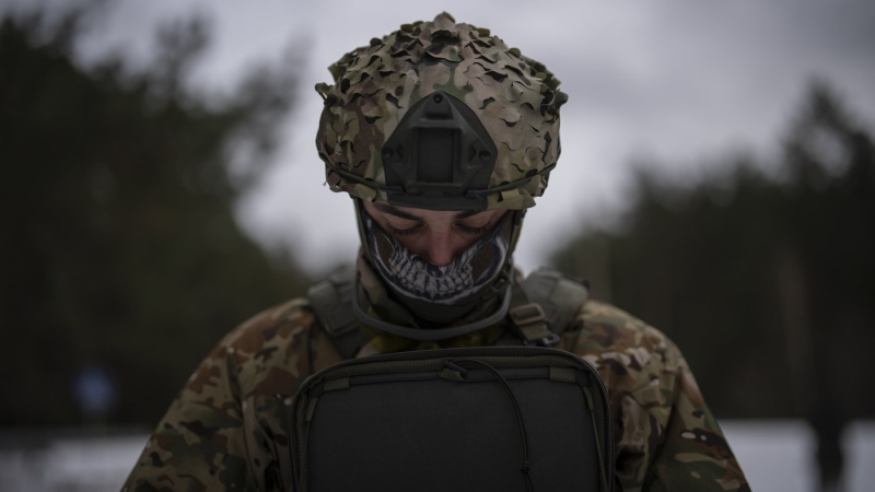 A Ukrainian serviceman controls a drone during a demonstration close to the border with Belarus, Ukraine, Wednesday, Feb. 1, 2023. (AP Photo/Daniel Cole)
