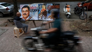 Sagar Kambli painting Indian businessman Gautam Adani in Mumbai, India, on Feb. 3, 2023. (Rajanish Kakade / AP) 