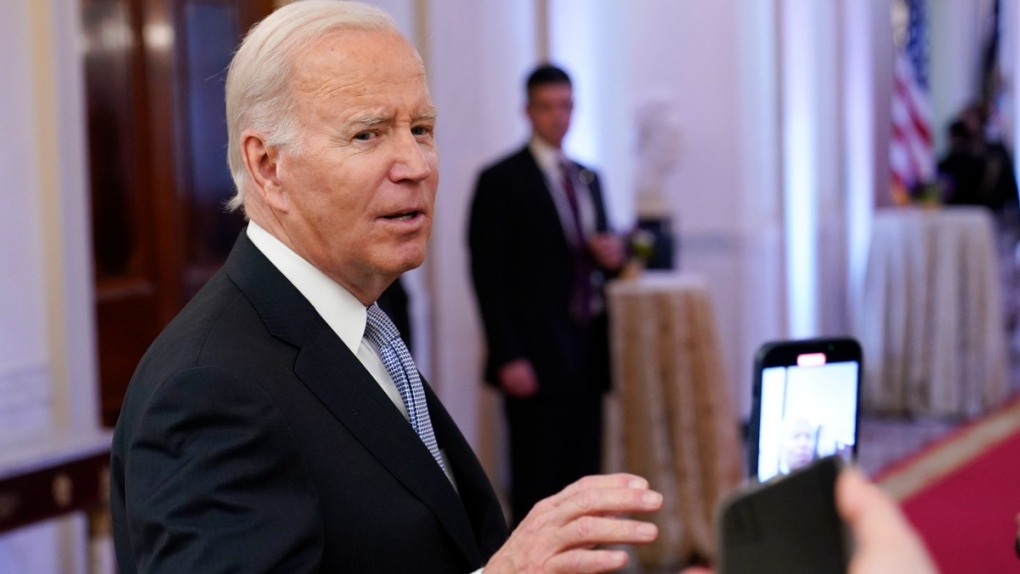 U.S. President Joe Biden talks with reporters