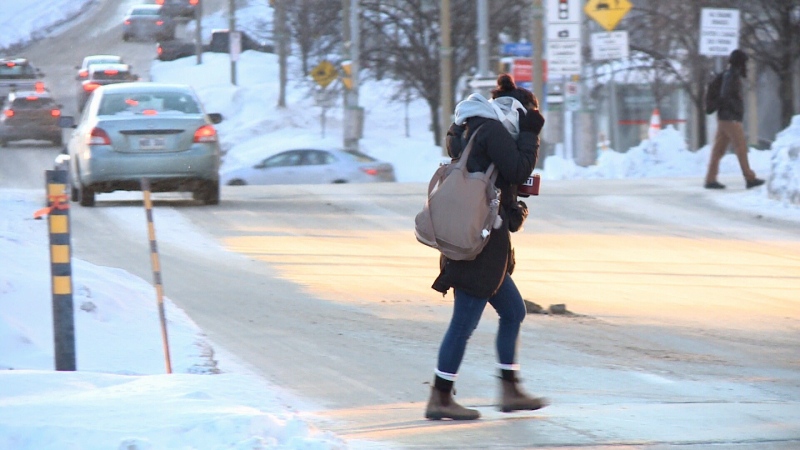 A pedestrian crosses the street in Ottawa on Friday, Feb. 3, 2023. (Jim O'Grady/CTV News Ottawa)