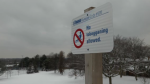 A sign restricting tobogganing on a Toronto hill. 