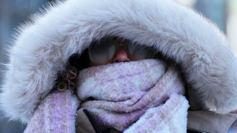 A person makes their way through frigid temperatures in downtown Ottawa on Friday, Feb. 3, 2023, as a cold snap hits eastern Ontario. (Sean Kilpatrick/THE CANADIAN PRESS)