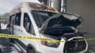 At least one shuttle van parked outside the hotel was heavily damaged in the blaze. The van remained behind police tape Friday morning. (CTV News)