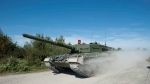 The new Canadian Forces Leopard 2A4 tank makes its way onto the firing range for a demonstration at CFB Gagetown in Oromocto, N.B., on Thursday, September 13, 2012. (THE CANADIAN PRESS/David Smith)
