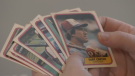 A Guelph woman shows off some of the baseball cards that are part of her father's Montreal Expos collection.