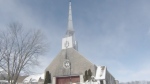 A funeral was held at this Saint-Roch-de-L'Achigan church on Feb. 2, 2023 for two workers killed in a propane explosion. (CTV News) 