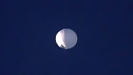 A high altitude balloon floats over Billings, Mont., on Wednesday, Feb. 1, 2023. (Larry Mayer/The Billings Gazette via AP)