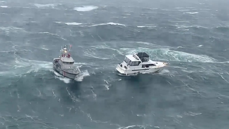 A man wanted by police in Oregon in a bizarre incident at a house featured in 'The Goonies' was the subject of a daring Coast Guard rescue. Coast Guard video from the rescue shows the vessel, at right, in distress. (US Coast Guard Pacific Northwest/CNN)