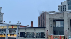 Black smoke coming from the 22nd floor of Les Suites Hotel on Besserer Street on Saturday. (Josh Pringle/CTV News Ottawa) 