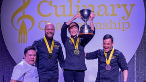 Chef Briana Kim from Ottawa (centre) won the 2023 Canadian Culinary Championship. Kim is flanked by Chef Bobby Milheron from Vancouver (silver) and Chef Serge Belair from Edmonton (bronze). Feb. 4, 2023. (Photo: greatkitchenparty.com)