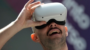 A man experiences a VR virtual reality headset during the The Dubai Metaverse Assembly at the Emirates Towers, in Dubai, United Arab Emirates, Wednesday, Sept. 28, 2022. (AP Photo/Kamran Jebreili)