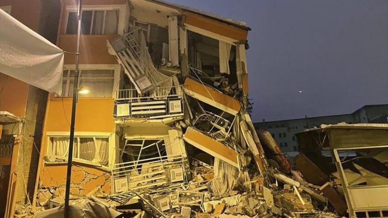 A collapsed building is seen following an earthquake in Pazarcik, in Kahramanmaras province, southern Turkiye, Feb. 6, 2023. (Depo Photos via AP)