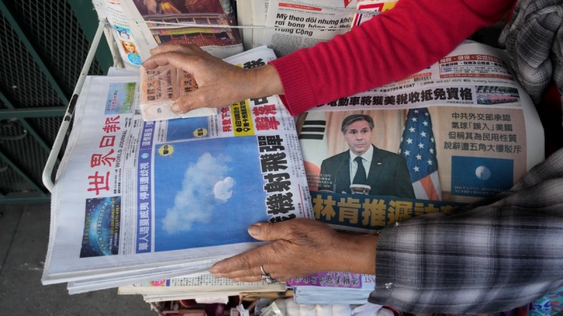 Chinese Daily News newspaper showcasing pictures of a suspected Chinese spy balloon, in the Chinatown district of Los Angeles, on Feb. 5, 2023. (Damian Dovarganes / AP) 