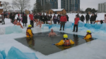 A nearly-naked man jumps in the icy cold waters of Kempenfelt Bay Feb. 5, 2023. (CTV NEWS BARRIE/CHRIS GARRY)