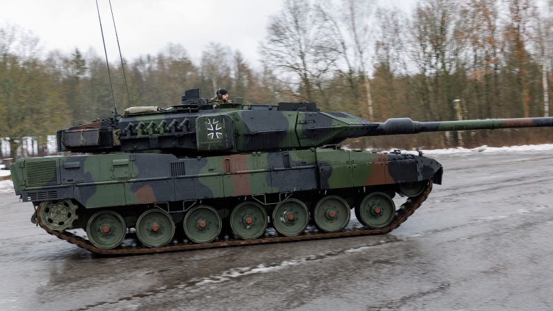 New Leopard 2 A7V tanks from the German Army stand on the barracks grounds during the ceremonial handover for Tank Battalion 104 in Pfreimd, Germany, Friday, Feb. 3, 2023. (Daniel Karmann/dpa via AP)