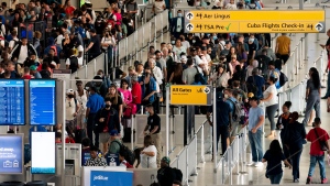 People wait in a TSA line at the John F. Kennedy International Airport in New York, on June 28, 2022. (AP Photo/Julia Nikhinson, File)