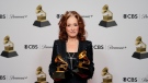 Bonnie Raitt poses in the press room with the awards for Best Americana Performance for "Made Up Mind" and Best American Roots Song for "Just Like That" at the 65th annual Grammy Awards on Sunday, Feb. 5, 2023, in Los Angeles. (AP Photo/Jae C. Hong)