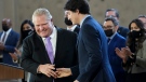 Prime Minister Justin Trudeau, right, shakes hands with Ontario Premier Doug Ford after reaching and agreement in $10-a-day child-care program deal in Brampton, Ont., on Monday, March 28, 2022. THE CANADIAN PRESS/Nathan Denette