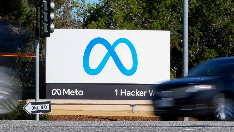 A car passes Facebook's new Meta logo on a sign at the company headquarters on Oct. 28, 2021, in Menlo Park, Calif. (AP Photo/Tony Avelar, File)