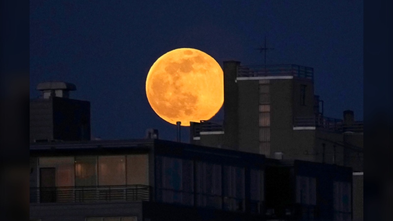 The full snow moon rises over Milwaukee, Sunday, Feb. 5, 2023. The next full moon, the worm moon, will be on March 7. (Mike De Sisti/Milwaukee Journal-Sentinel via AP)