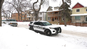 Winnipeg police are pictured at the scene of a shooting in the 500 block of Spence Street on Feb. 5, 2023 (CTV News Winnipeg Photo)