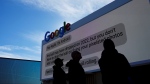 Workers help set up the Google booth at the Las Vegas Convention Center before the start of the CES tech show, Monday, Jan. 2, 2023, in Las Vegas. (AP Photo/John Locher) 