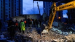 Emergency team members search for people in a destroyed building in Adana, Turkiye, Monday, Feb. 6, 2023. (AP / Khalil Hamra) 
