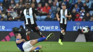 Leicester's Jonny Evans, left, and Newcastle's Christian Atsu challenge for the ball during an English Premier League soccer match at King Power Stadium in Leicester, England, Sept. 29, 2019. (AP Photo/Rui Vieira)