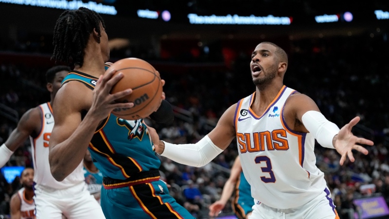 Phoenix Suns guard Chris Paul (3) defends Detroit Pistons guard Jaden Ivey (23), on Feb. 4, 2023. (Paul Sancya / AP) 
