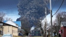 A black plume rises over East Palestine, Ohio, as a result of a controlled detonation of a portion of the derailed Norfolk and Southern trains Monday, Feb. 6, 2023. (AP Photo/Gene J. Puskar)
