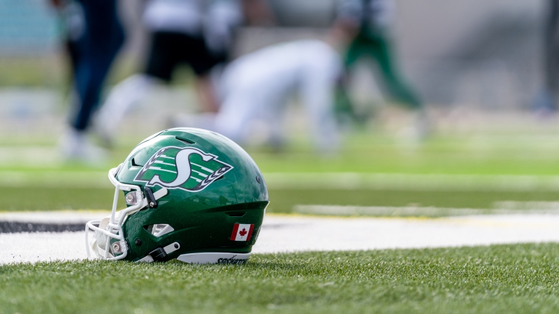 A football helmet sits on the field during the first day of the team’s training camp at Griffiths Stadium in Saskatoon, Sask., on Friday, May 20, 2022. THE CANADIAN PRESS/Heywood Yu