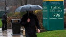 An unidentified man heads past the Halifax Infirmary in Halifax on Tuesday, April 24, 2012. (THE CANADIAN PRESS/Andrew Vaughan)
