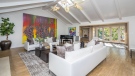 Jim Carrey's painting 'Hooray We Are All Broken' hanging on the wall of his L.A. home for sale. (Source: Sotheby's via CNN)