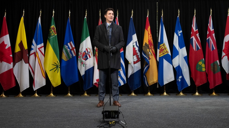 Prime Minister Justin Trudeau speaks with media as he arrives for a health care meeting with premiers, Tuesday, February 7, 2023 in Ottawa. THE CANADIAN PRESS/Adrian Wyld 