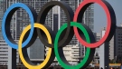 In this Dec. 1, 2020, file photo, the Olympic Symbol is reinstalled after it was taken down for maintenance ahead of the postponed Tokyo 2020 Olympics in the Odaiba section in Tokyo. (AP Photo/Eugene Hoshiko, File)