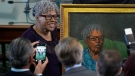 Opal Lee, left, who worked to help make Juneteenth a federally-recognized holiday, poses with her portrait after is was unveiled in the Texas Senate Chamber, Wednesday, Feb. 8, 2023, in Austin, Texas. (AP Photo/Eric Gay)