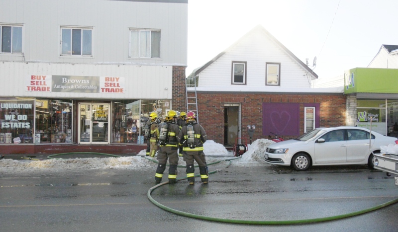 One person is in hospital with injuries and is also in police custody following a fire Wednesday on Main Street East in North Bay. (Eric Taschner/CTV News)