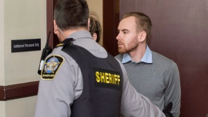 William Sandeson, right, is escorted into his preliminary hearing at provincial court in Halifax on Thursday, February 11, 2016. THE CANADIAN PRESS/Darren Calabrese 