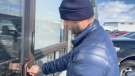 Employee Chris Neron discovers the locks at one of Highbridge Construction's offices have been changed. (Katie Griffin/CTV News Ottawa)