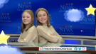 Katie and young visitor sit at the CTV anchor desk in Sudbury. Feb. 7/23 (CTV Northern Ontario)