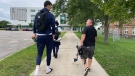 Olivier Rioux, left, is seen walking with CTV staff. (Shelley Ayres)