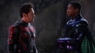 This image released by Disney shows Paul Rudd, left, and Jonathan Majors in a scene from "Ant-Man and the Wasp: Quantumania." (Disney/Marvel Studios via AP)
