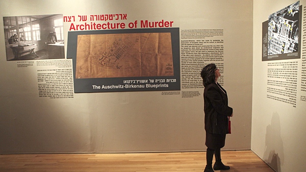 A journalist is seen during a presentation to the media before the opening of an exhibition, showing the blueprints of the Nazi death camp of Auschwitz, at the Yad Vashem Holocaust memorial in Jerusalem, Sunday, Jan. 24, 2010. (AP / Dan Balilty)