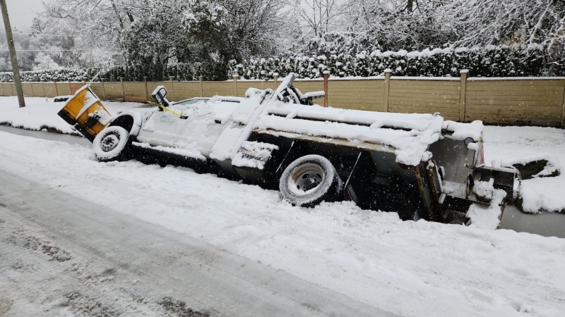 Vancouver snowplow gets stuck in ditch during storm thumbnail