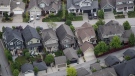 Houses are seen in an aerial view in Langley, B.C., on Wednesday May 16, 2018. THE CANADIAN PRESS/Darryl Dyck