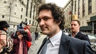 Sam Bankman-Fried arrives at federal court in New York last month. Prosecutors want Bankman-Fried to use a flip phone as part of a more restrictive bail package. (Stephanie Keith/Bloomberg/Getty Images)
